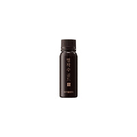 a black bottle of VITALBEAUTIE Red Ginseng Gold Extract Ampoule on white background