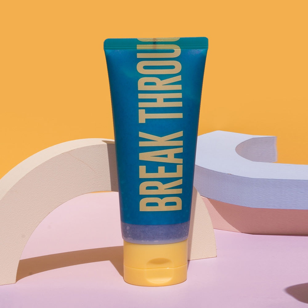 A 100ml bottle of Dear Doer Body Scrub, ideal for exfoliating and rejuvenating the skin.