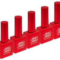 a row of red nail polish bottles sitting next to each other