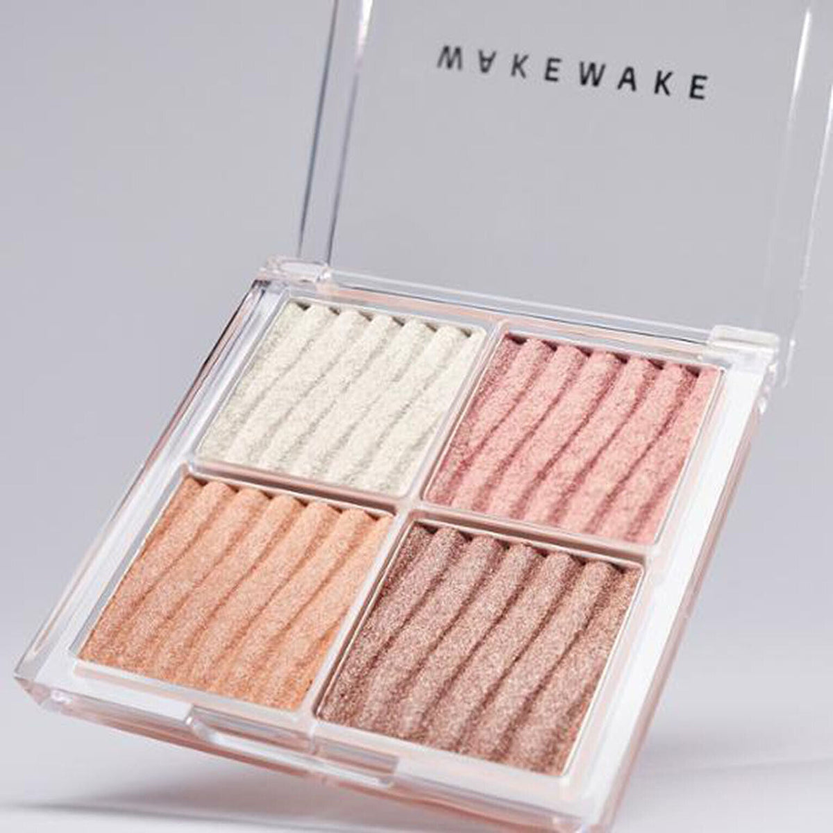 A 7.8g WAKEMAKE Glow Contouring Highlighter Palette with various shades for highlighting and contouring.